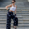 Woman wearing Ankara palazzo pants with wide leg silhouette
