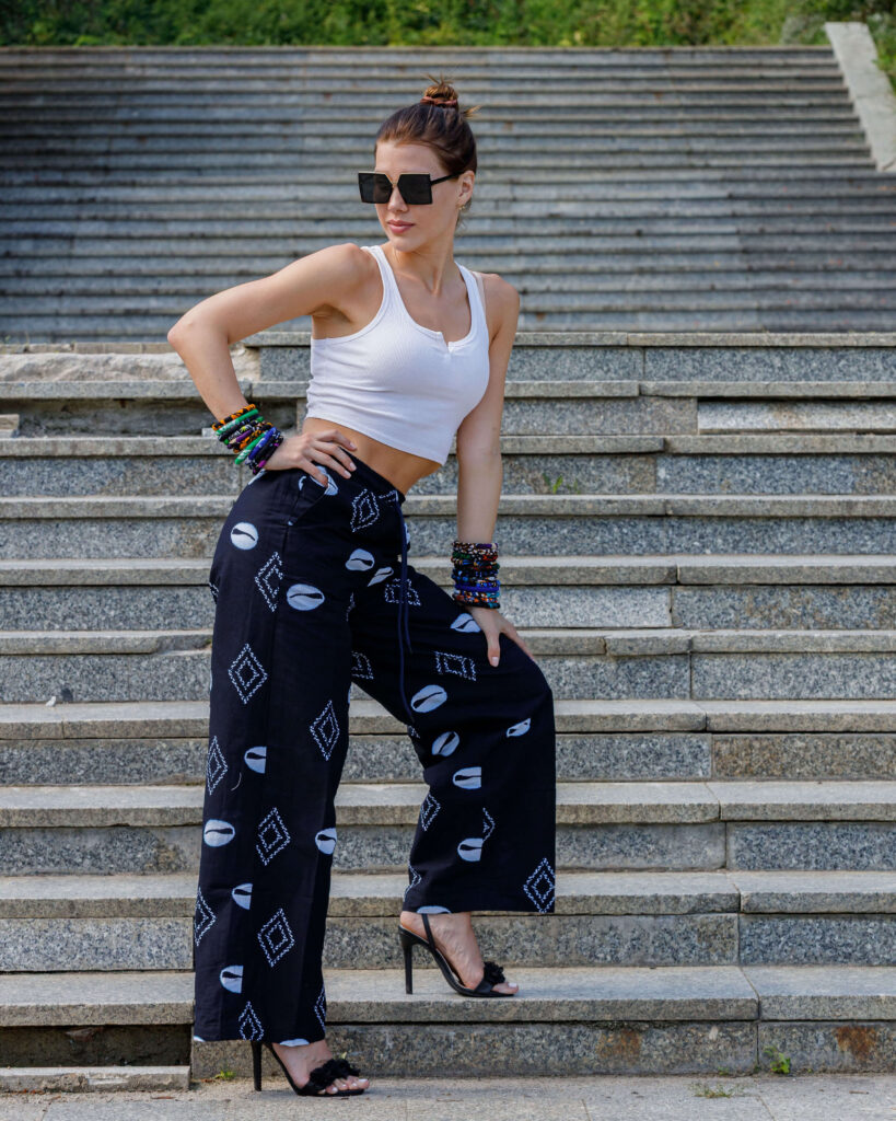Woman wearing Ankara palazzo pants with wide leg silhouette