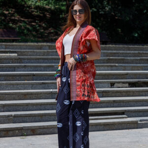 Woman wearing a handcrafted Adire Agbada with Aso oke trim