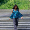 Woman wearing an Ankara flared sleeveless swing top