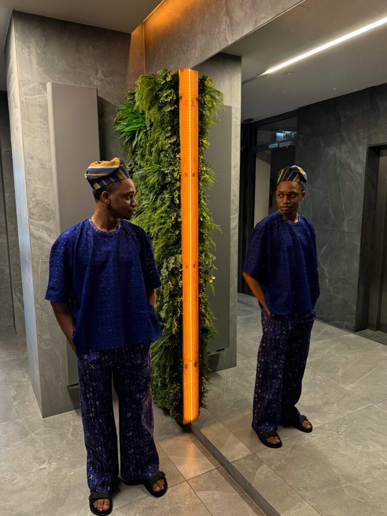 Man wearing Nigerian Adire co-ord set with Dry Lace crop top