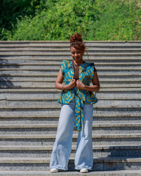 Woman wearing a fitted Ankara peplum top