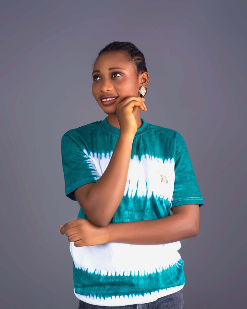Model wearing BINTA Adire football jersey